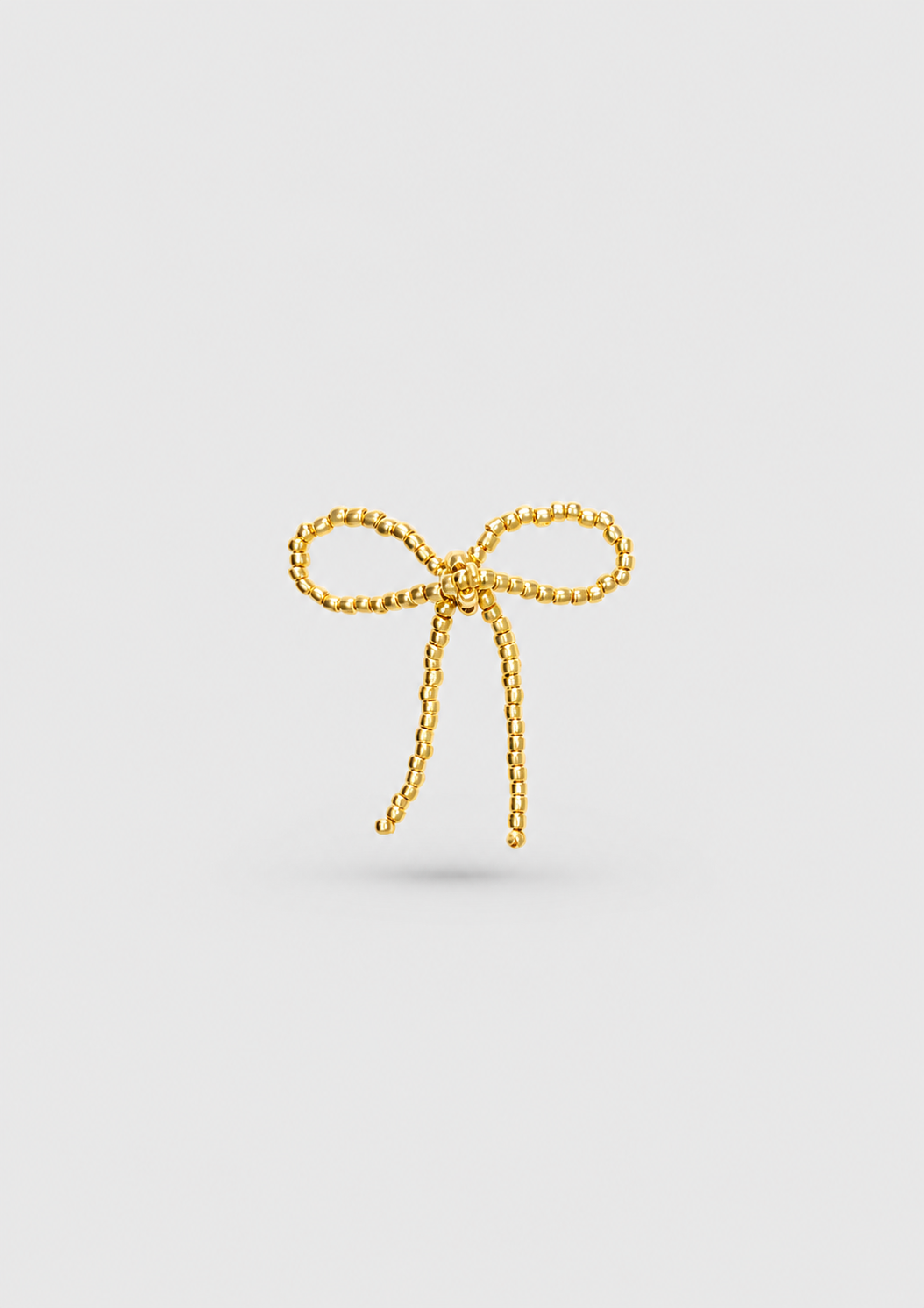 GOLD BOW EAR STICKS