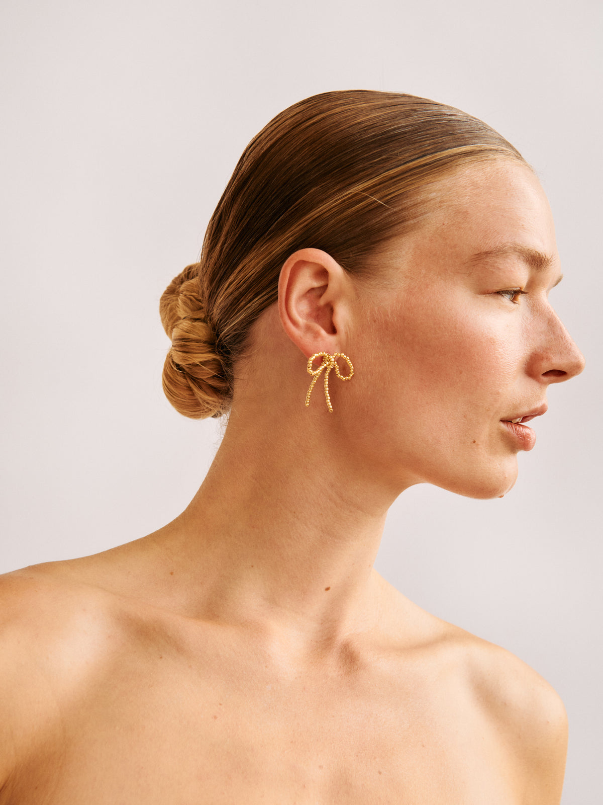 GOLD BOW EAR STICKS