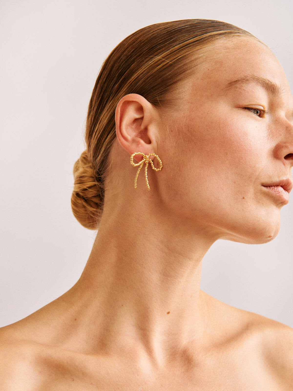 GOLD BOW EAR STICKS