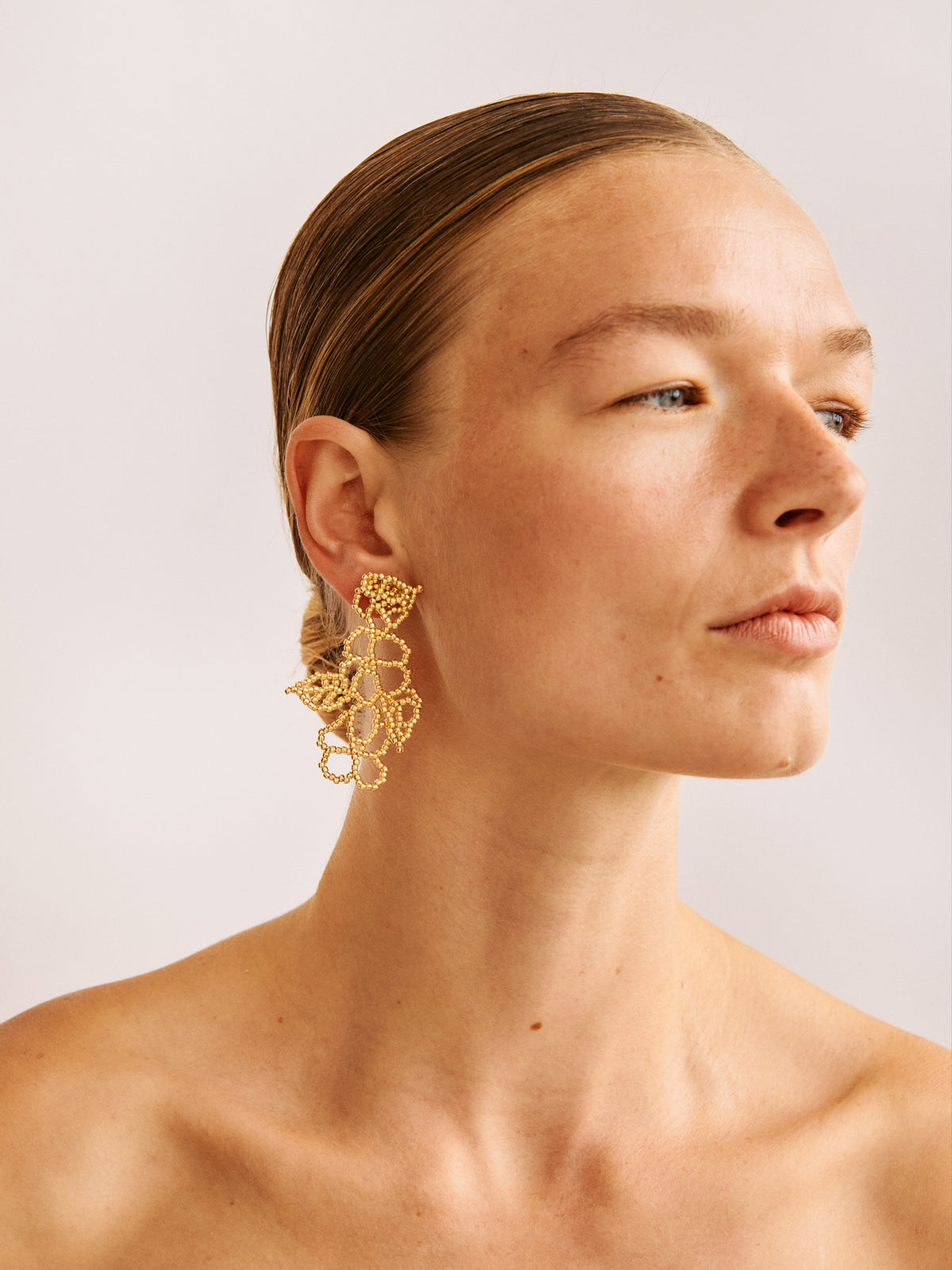 GOLD FLOWER EAR STICKS