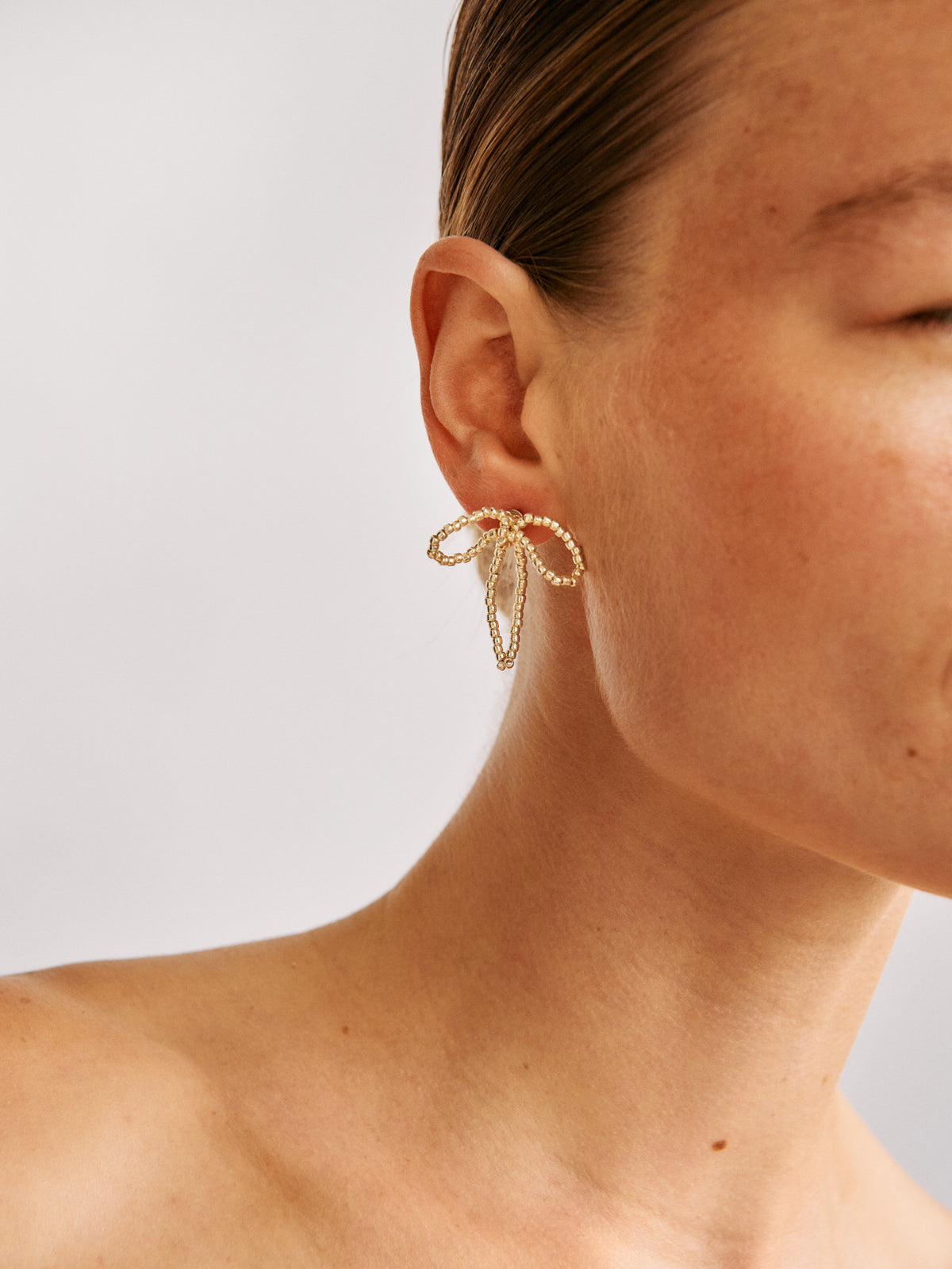 SILVER BOW EAR STICKS