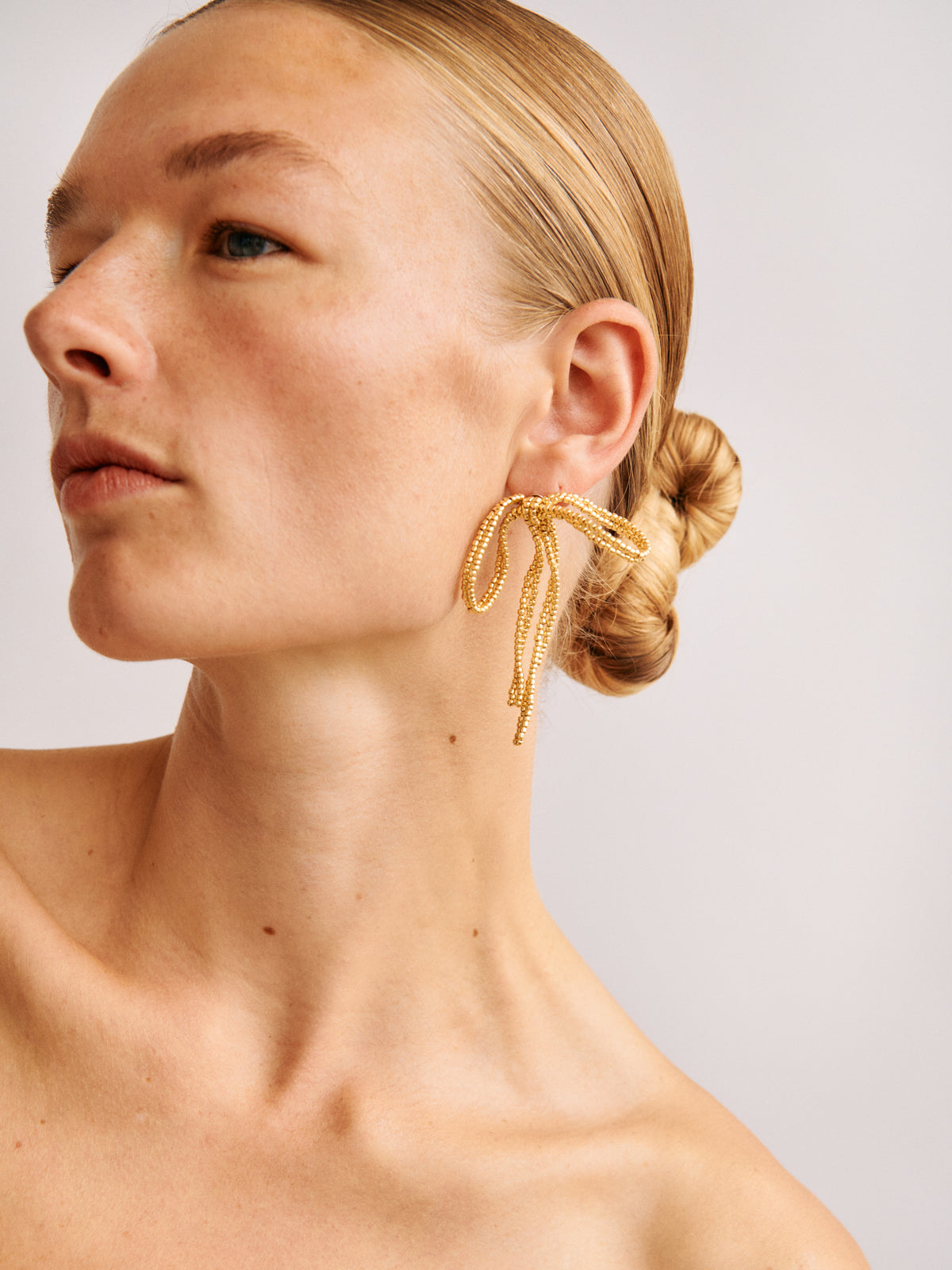 GOLD BIG BOW EAR STICKS